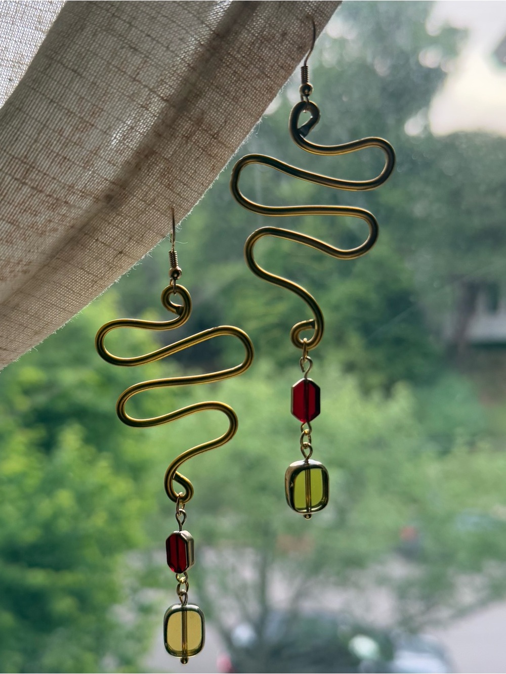 Gold Swirl Dangle Earrings with Red and Olive Beads